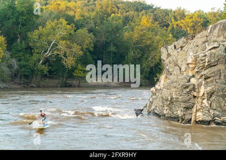 Ian Brown stand up paddle surfs a whitewater wave on the Potomac River near Potomac, Maryland, United States of America, North America Stock Photo