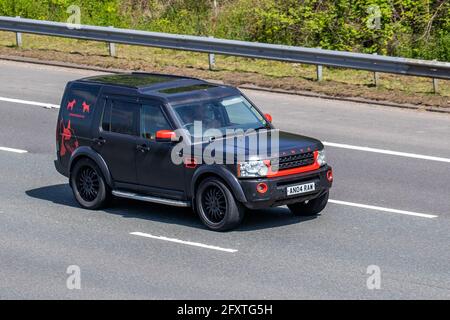 Range Rover 2004 (04) 3.0 Td6 HSE 5dr · 2.9L Red grey Hawke Osprey modified custom Land Rover; Commercial business vehicular traffic, moving vehicles, saloon cars, personalised vehicle driving on UK roads, luxury motors, SUV motoring on the M6 motorway highway UK road network. Stock Photo