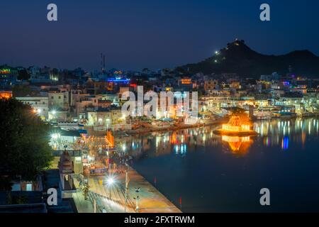 View of indian pilgrimage sacred city Pushkar with Pushkar ghats. Rajasthan, India. Horizontal pan Stock Photo