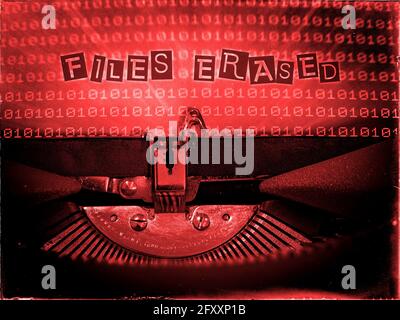 Files Erased, Mechanical Typewriter, Binary code background, Red tone, Vintage distorted look, Ransom note typography Stock Photo