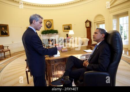 President Barack Obama meets alone with Chief of Staff Rahm Emanuel in the Oval Office on his first full day in office. 1/21/09Official White House Photo by Pete Souza Stock Photo