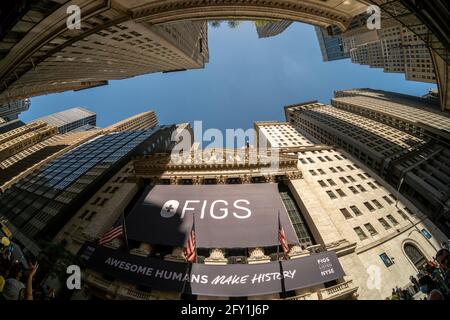 New York, USA. 27th May, 2021. The New York Stock Exchange on Thursday, May 27, 2021 is decorated for the initial public offering for FIGS, a clothing retailer. FIGS sells scrubs, previously popular only with hospital personnel, but are now fitted and are popular with the non-medical crowd especially during the pandemic when people purchased comfortable loose clothing. (Photo by Richard B. Levine) Credit: Sipa USA/Alamy Live News Stock Photo