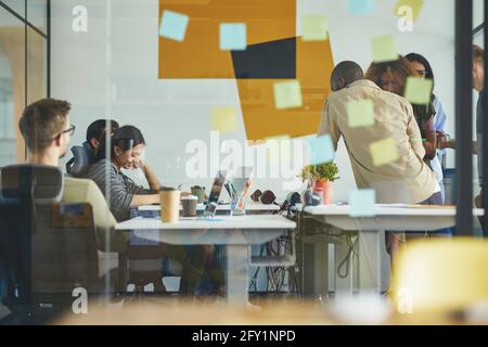 Young professionals working on task solution together Stock Photo