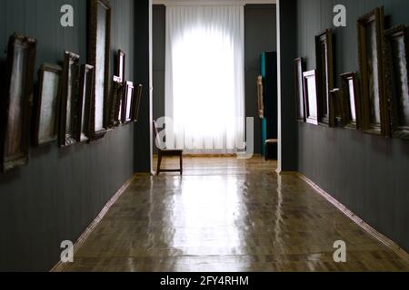 Sunlight through white curtains at the end of art gallery corridor Stock Photo