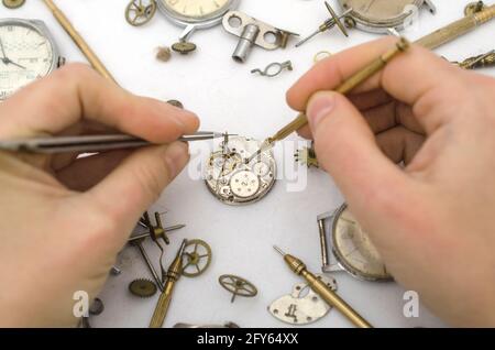 Repair of mechanical watches isolated on white Stock Photo