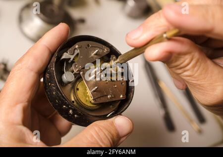 Repair of mechanical watches isolated on white Stock Photo