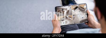 Security System CCTV Video Spy Cameras On Tablet Stock Photo