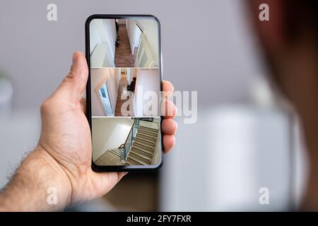 Security System CCTV Video Spy Cameras On Phone Stock Photo