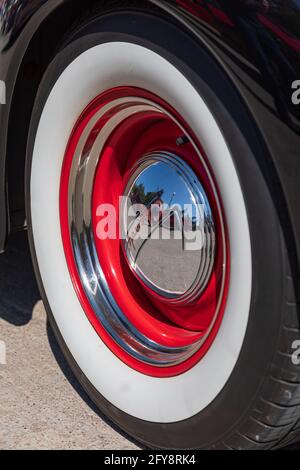 Marble Falls, Texas, USA. April 10, 2021. Whitewall tire and chrome hub cap on a vintage Chevrolet. Stock Photo