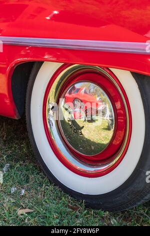 Marble Falls, Texas, USA. April 10, 2021. Whitewall tire and chrome hub cap on a vintage Ford. Stock Photo