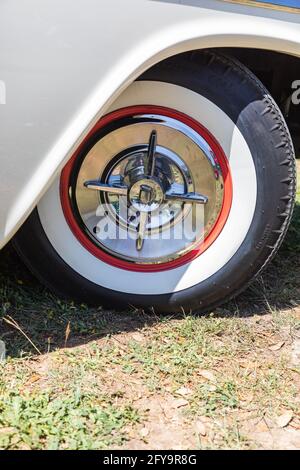 Marble Falls, Texas, USA. April 10, 2021. Whitewall tire and chrome hubcap on a vintage Dodge Coronet. Stock Photo