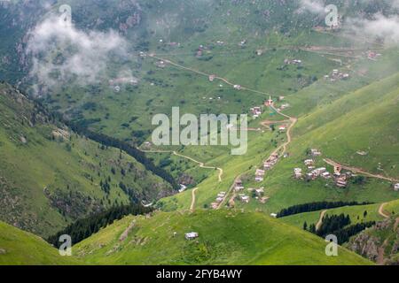 High resolution, magnificent mountain view captured from a high angle by a drone camera. This landscape, accompanied by very high clouds, has a rare Stock Photo