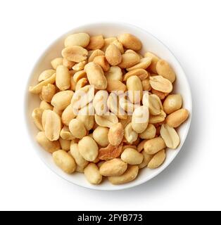 bowl of roasted salted peanuts isolated on white background, top view Stock Photo
