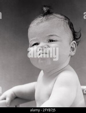 serious baby face pouting upset babies children Stock Photo - Alamy