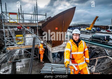 Construction workers in action on construction site Stock Photo
