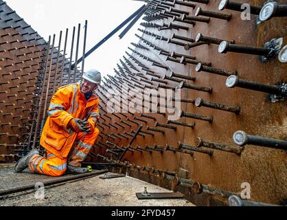 Construction workers in action on construction site Stock Photo