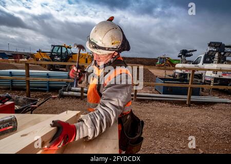 Construction workers in action on construction site Stock Photo