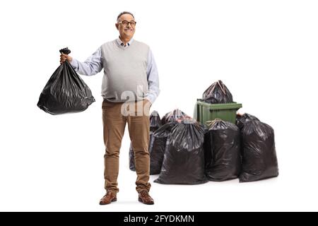 https://l450v.alamy.com/450v/2fydkmn/full-length-portrait-of-a-mature-man-holding-a-waste-bag-near-a-pile-of-bags-and-a-bin-isolated-on-white-background-2fydkmn.jpg