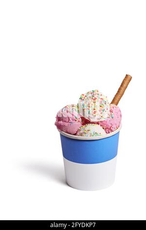 Ice cream scoops in a paper cup with colorful sprinkles and a chocolate wafer stick isolated on white background Stock Photo