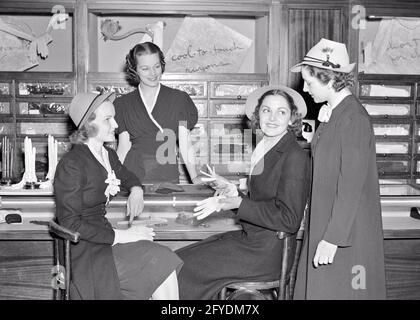 1940s GROUP OF SMILING YOUNG MEN AND WOMEN WITH REELS OF FILM SETTING UP  HOME MOVIE PROJECTOR - u591 HAR001 HARS OLD FASHION JUVENILE STYLE  COMMUNICATION YOUNG ADULT RELAXING LIFESTYLE FIVE FEMALES