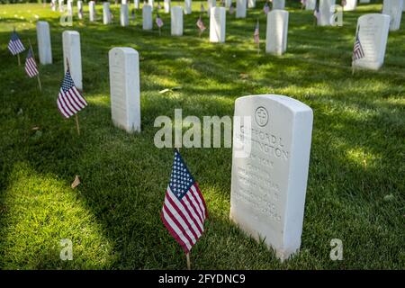 Arlington, United States. 27th May, 2021. Flags are seen in front of gravestones at Arlington National Cemetery at Arlington National Cemetery in Arlington, Virginia, on Thursday, May 27, 2021. Soldiers placed approximately 260,000 small American flags at headstones in advance of Memorial Day on Monday. Photo by Tasos Katopodis/UPI Credit: UPI/Alamy Live News Stock Photo