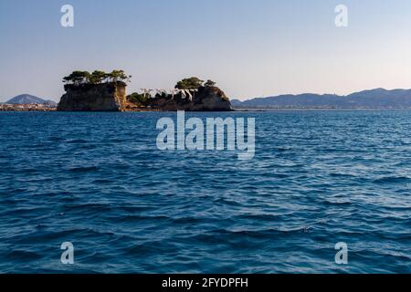 View from the sea to the popular beach among young people on the island of Zakynthos, Greece. Stock Photo