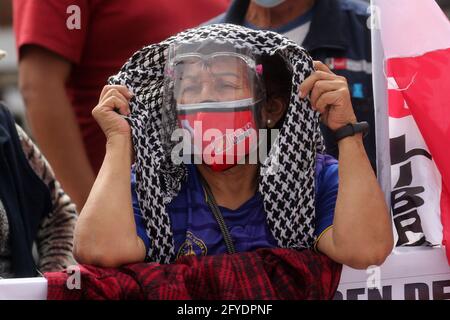 Lima, Peru. 26th May, 2021. People attend a campaign rally for Presidential candidate Pedro Castillo, in Villa El Salvador neighborhood. On June 6 Peruvians will go to the polls to elect new President between Castillo and Keiko Fujimori. Credit: Mariana Bazo/ZUMA Wire/Alamy Live News Stock Photo