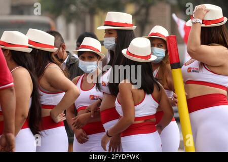 Lima, Peru. 26th May, 2021. People attend a campaign rally for Presidential candidate Pedro Castillo, in Villa El Salvador neighborhood. On June 6 Peruvians will go to the polls to elect new President between Castillo and Keiko Fujimori. Credit: Mariana Bazo/ZUMA Wire/Alamy Live News Stock Photo