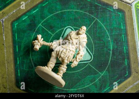 Roseville, MN, USA, 02.04.2021 - Fallout Board Game Plastic Figure on Map Tile Stock Photo