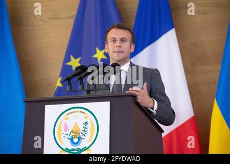 Kigali, Rwanda. 27th May, 2021. Visiting French President Emmanuel Macron speaks at a joint press conference with Rwandan President Paul Kagame (not seen in the picture) in Kigali, Rwanda, on May 27, 2021. Rwandan President Paul Kagame on Thursday said Rwanda and France are going to 'relate much better' to the benefit of two peoples, politically, economically and culturally, during a joint press conference in Kigali with the visiting French President Emmanuel Macron. Credit: Cyril Ndegeya/Xinhua/Alamy Live News Stock Photo