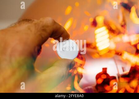 Man pov looking at AirTag with printed engraving KEY text Stock Photo