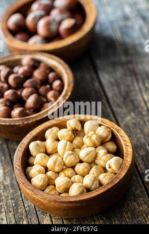 Peeled roasted hazelnut kernels in bowl. Stock Photo