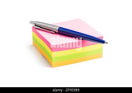 Blank sticky paper notepad and penisolated on white background. Stock Photo