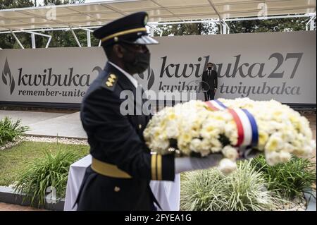 French President Emmanuel Macron readies to lay a wreath in front of 'Kwibuka 27' or âÂ€Â˜remember-unite-renewâÂ€Â™ which marks the 27th anniversary of the start of the 1994 genocide against the Tutsi in Rwanda, during visit to the Kigali Genocide Memorial, where some 250,000 victims of the massacres are buried, in Kigali on May 27, 2021. Photo by Eliot Blondet/ABACAPRESS.COM Stock Photo