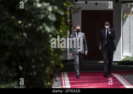 French President Emmanuel Macron (L) walks along side Rwandan President Paul Kagame in the grounds of the Presidential Palace in Kigali on May 27, 2021. Photo by Eliot Blondet/ABACAPRESS.COM Stock Photo