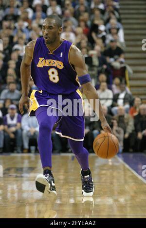 SACRAMENTO, UNITED STATES - Mar 14, 2006: Kobe Bryant doing a jump Lay up against Sacramento Kings. Stock Photo