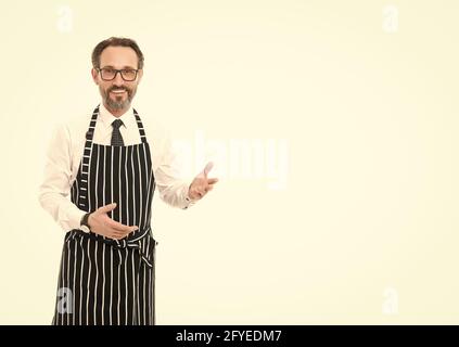 welcome to my world. cooking in kitchen. confident chef in apron. catering business. mature male cook isolated on white. bearded man baker in glasses Stock Photo