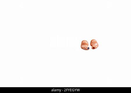 In the ear hearing aids on white .  Text free space ,landscape format and cropped Stock Photo