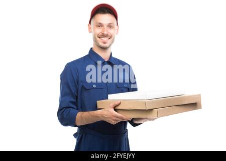 Horizontal medium portrait of handsome young adult Caucasian pizza guy holding boxes looking at camera, white background Stock Photo