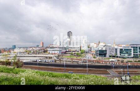 Sheffield City Centre UK no logos or signs panoramic wide angle view steel city with railway station and Hallam university campus under dramatic sky. Stock Photo