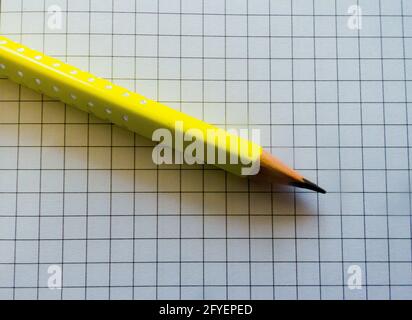yellow pencil on a notebook Stock Photo