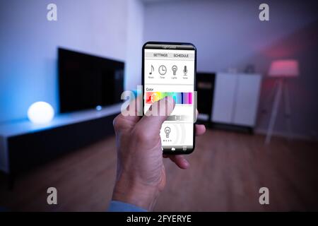 Smart Light Control Using Mobile Phone And Smarthome Stock Photo