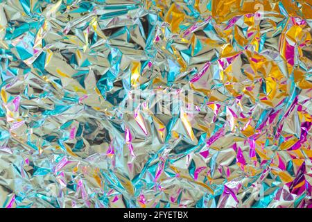 https://l450v.alamy.com/450v/2fyetbx/bright-young-juicy-chrome-bold-crumpled-texture-foil-with-gradient-color-of-magenta-and-yellow-amazing-fusion-futuristic-background-good-for-party-2fyetbx.jpg