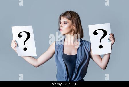 Question mark, symbol. Concept - challenging issue, looking for the answer. Girl question. Woman with doubtful expression and question marks. Thinking Stock Photo