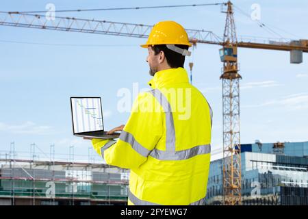 Industrial Engineer In Helmet At Construction Site Stock Photo