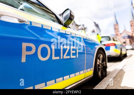 Freiburg, Germany. 05th May, 2021. Two police vehicles are parked at the side of the road in Freiburg. Credit: Philipp von Ditfurth/dpa/Alamy Live News Stock Photo