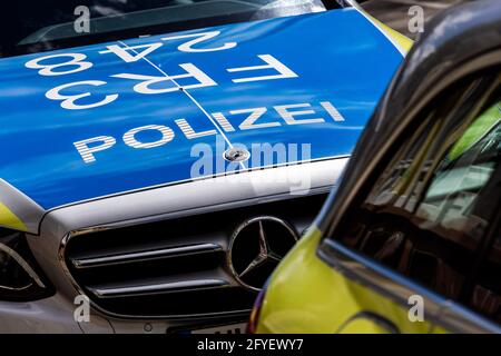 Freiburg, Germany. 05th May, 2021. Two police vehicles are parked at the side of the road in Freiburg. Credit: Philipp von Ditfurth/dpa/Alamy Live News Stock Photo