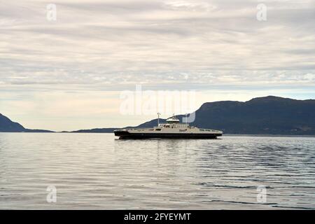 MOLDE, NORWAY - Jul 26, 2020: Fjord1 ferry line is crossing the Fannefjord at Molde in west Norway. Fjord1 is a Norwegian shipping company. Stock Photo