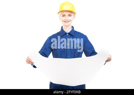 Horizontal medium portrait of modern professional female construction worker wearing blue uniform holding construction plan paper, white background Stock Photo