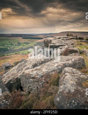 The Knuckle Stone. The Knuckle stone at Carhead rocks taken on a very cold spring evening. Carhead Rocks is a small gritstone edge that is just below S Stock Photo